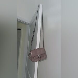 I’m selling a grey leather Michael kors cross body purse